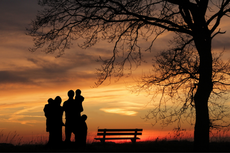 Myths about life insurance. Family in park, watching a sunset